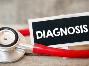 Limb-Girdle MD Diagnosis | Muscular Dystrophy News | Image of red stethoscope and small label that reads 'diagnosis'