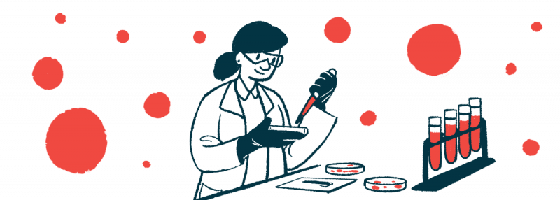 A researcher does lab work with vials stacked in front of her.