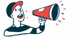 A person wearing a baseball cap speaks into a cone-shaped megaphone.