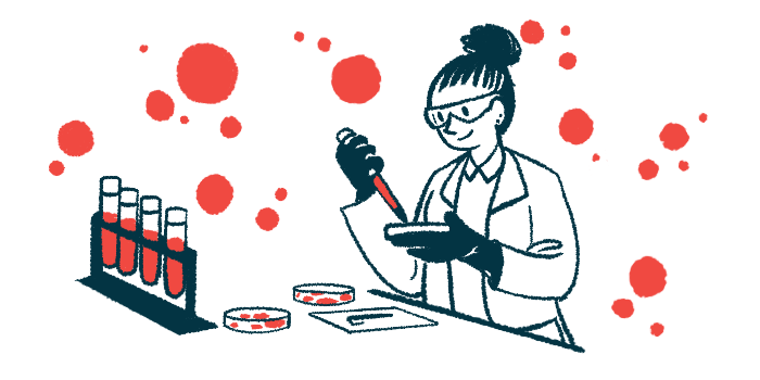 A scientist uses a dropper and a petri dish to test blood samples in a laboratory.