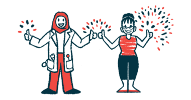 A clinician and another person stand side by side, flashing a thumb's up sign.
