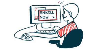 A person sits at a computer with the words 