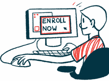 A person sits at a computer with the words 