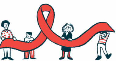 Four people each hold up part of a giant red awareness ribbon.