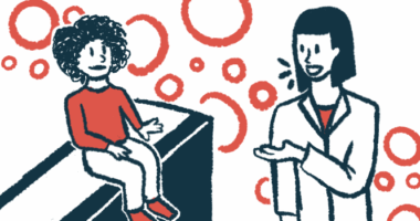 A child sits on an examining table as a clinician gestures toward her.
