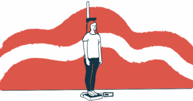 A person standing on a scale has their weight and height measured.