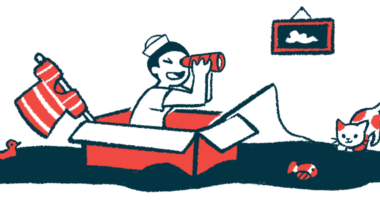 A child uses a cardboard box as a boat and peers through a spyglass while pretending to be a sailor.