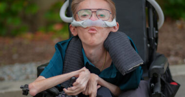 a young man with muscular dystrophy is shown.