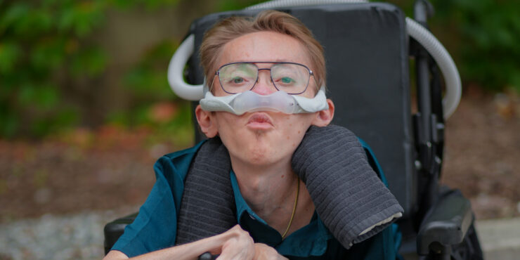 a young man with muscular dystrophy is shown.